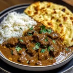 Slow-Cooked Beef Curry in Coconut Gravy with Toasted Garlic Naan